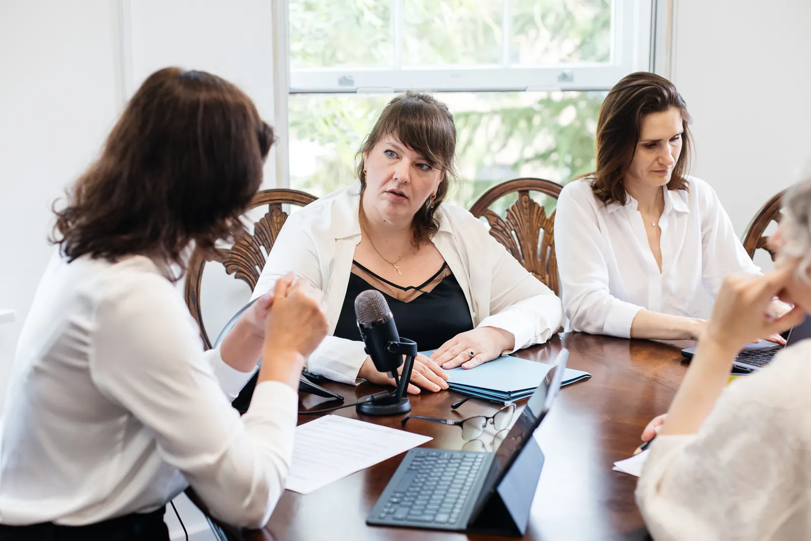 The Kairos-K team discussing a client's accounts around the table